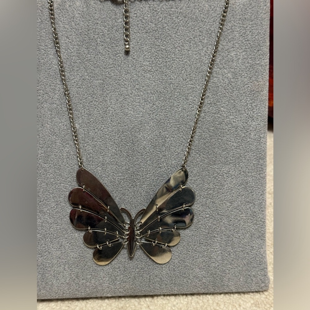 Vintage 18 inch silver necklace with chain and butterfly design very nice.